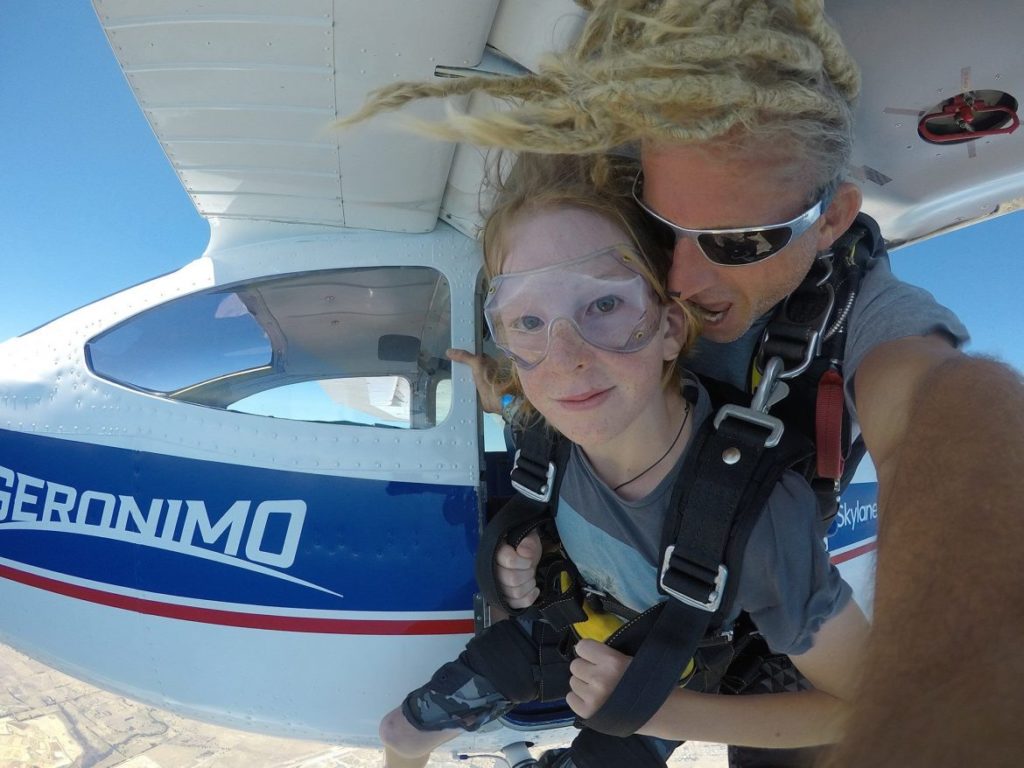 Dad and kid sky diving