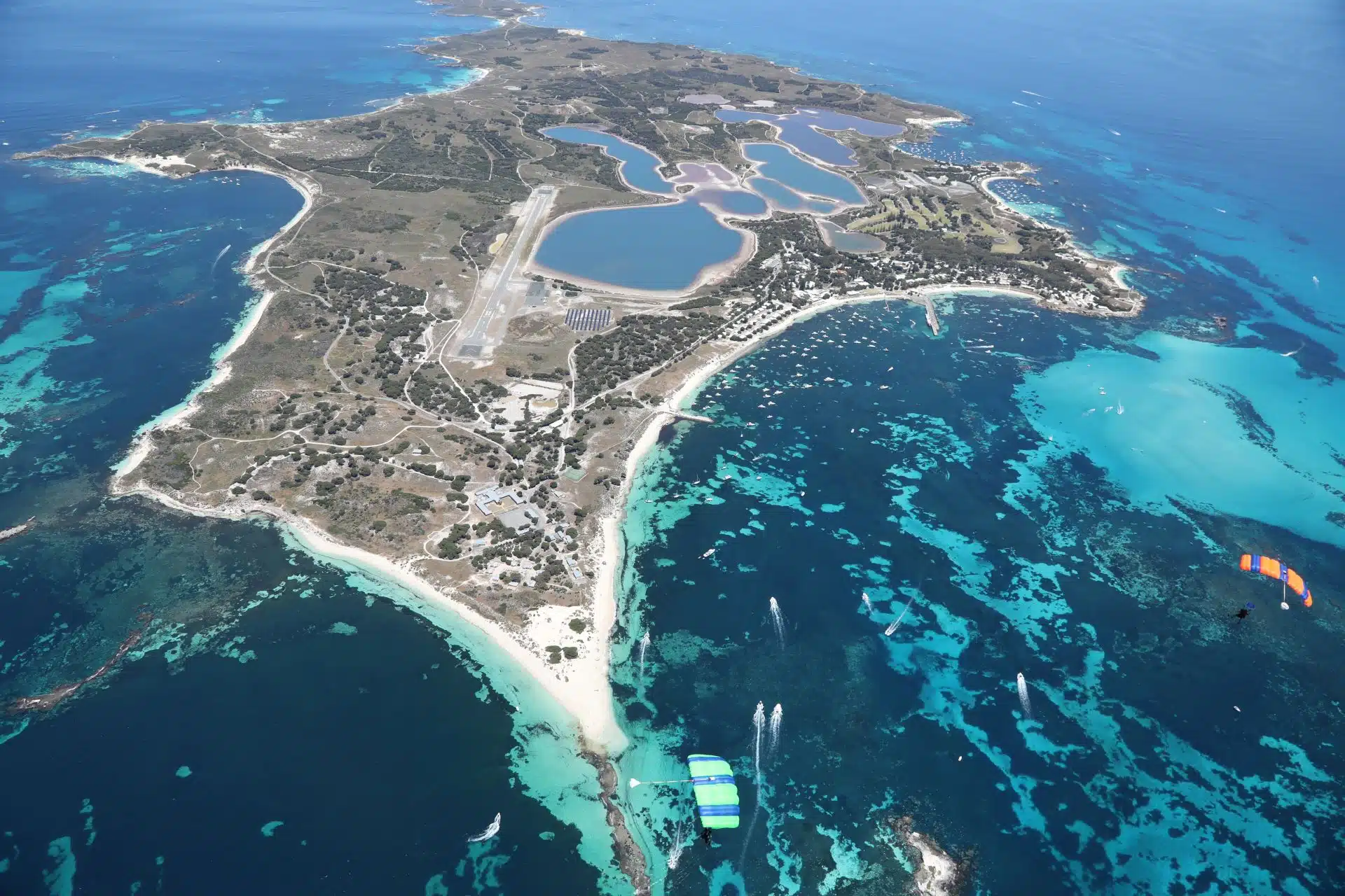 Aerial photo of Rottnest Island with skydiving canopies